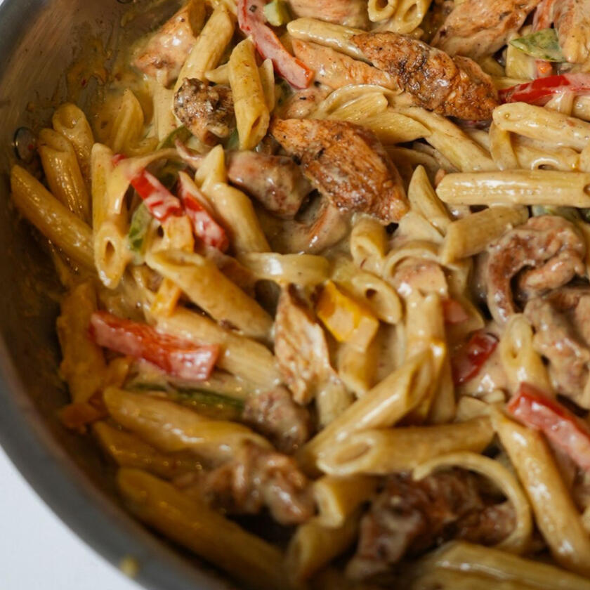 Pasta cooked in heavy cream, coconut milk, parmesan cheese, bell peppers and shrimp or chicken