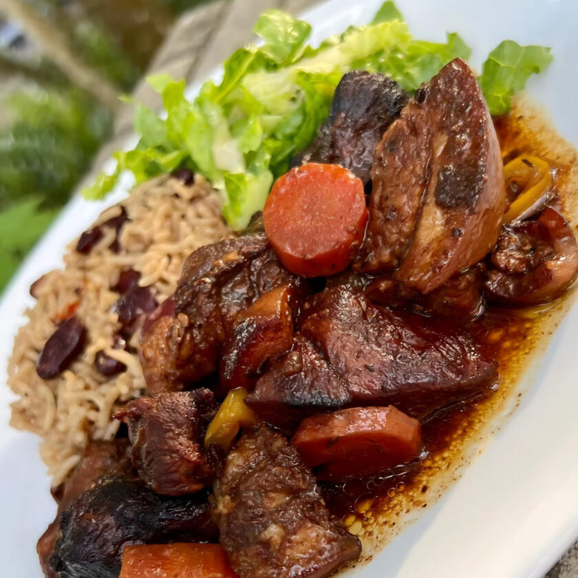 **BROWN STEW PORK/ JERK PORK $22** - Pork Pieces simmered in savoury brown stew sauce