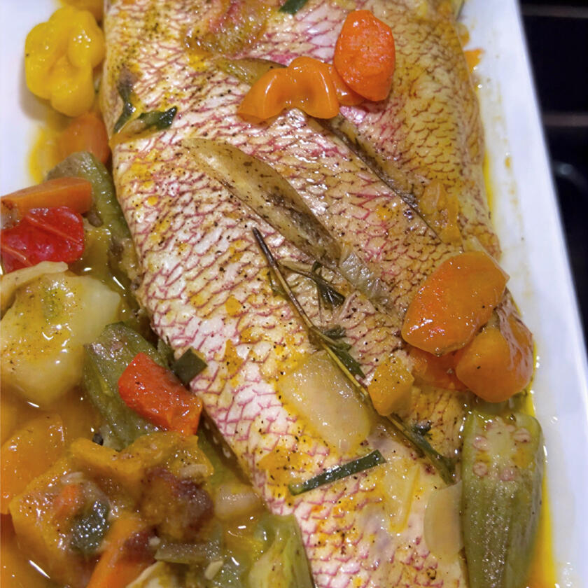 Steamed roast Snapper(or King Fish) stuffed with seasoned vegetables and okra
