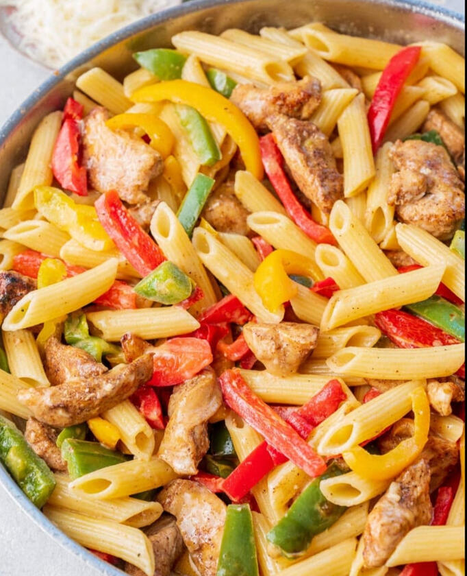 Pasta cooked in heavy cream, coconut milk, parmesan cheese, bell peppers and shrimp or chicken