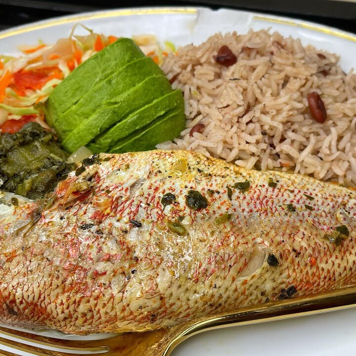 Steamed roast Snapper(or King Fish) stuffed with seasoned vegetables and okra